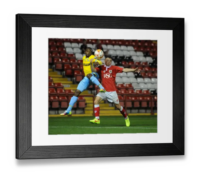 Framed Print : Intense Rivalry: Young Footballers Battle for Ball Possession - Bristol City U21s vs Crystal Palace U21s