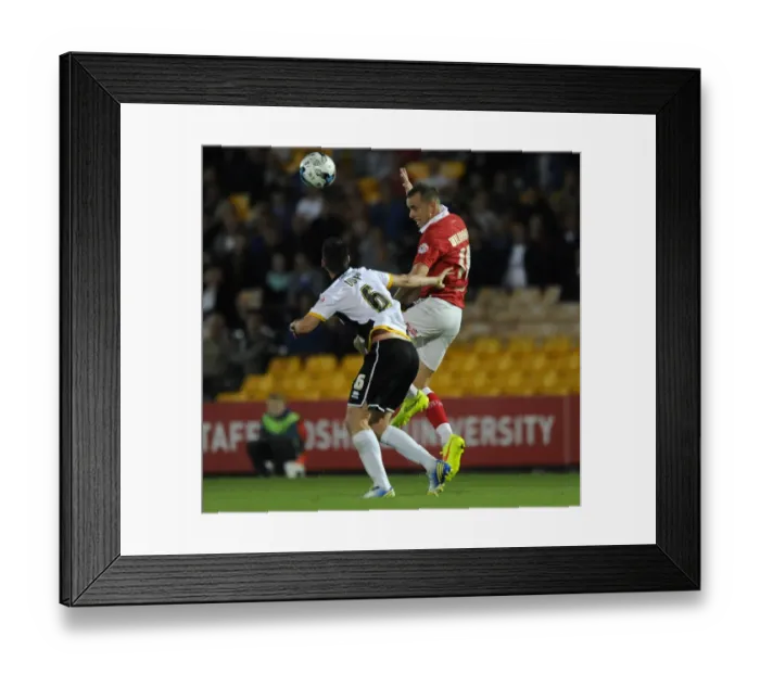 Framed Print : Bristol City's Wilbraham Outjumps Duffy to Head the Ball in Port Vale vs. Bristol City Football Match, September 16, 2014 Framed Print : Bristol City's Wilbraham Outjumps Duffy to Head the Ball in Port Vale vs. Bristol City Football Match, September 16, 2014
