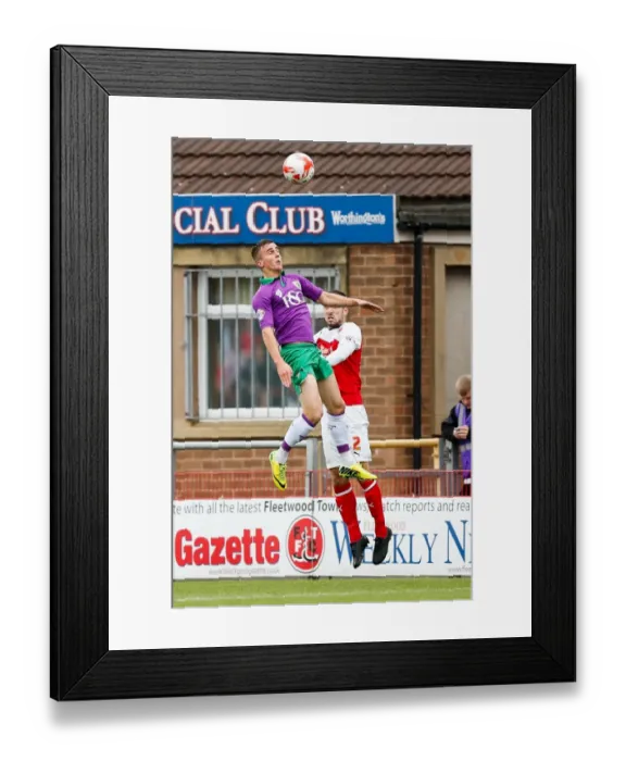 Framed Print : Bristol City's Joe Bryan and Fleetwood Town's Conor McLaughlin Battle for Aerial Supremacy in Fleetwood Town v Bristol City Football Match, Sky Bet League 1, Highbury Stadium, 2014