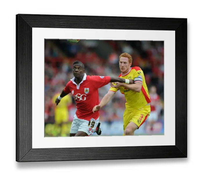 Framed Print : Bristol City vs MK Dons: Intense Battle for Possession between Kieran Agard and Dean Lewington