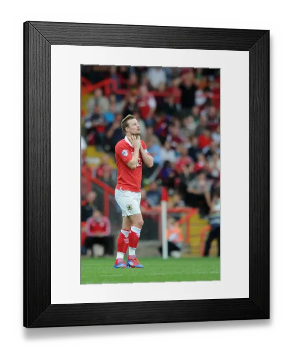 Framed Print : Dejected Wade Elliott After Costly Giveaway in Bristol City's Loss to MK Dons Framed Print : Dejected Wade Elliott After Costly Giveaway in Bristol City's Loss to MK Dons