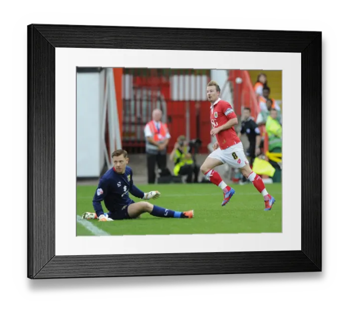 Framed Print : Bristol City's Thrilling Victory: Wade Elliott's Game-Winning Goal vs. MK Dons at Ashton Gate