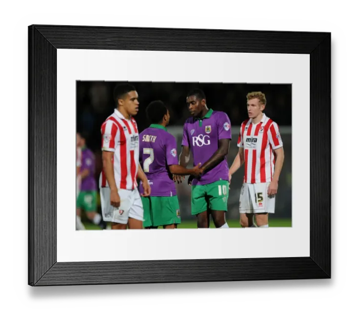 Framed Print : Korey Smith and Jay Emmanuel-Thomas of Bristol City Share a Moment after Cheltenham Town Match, October 8, 2014