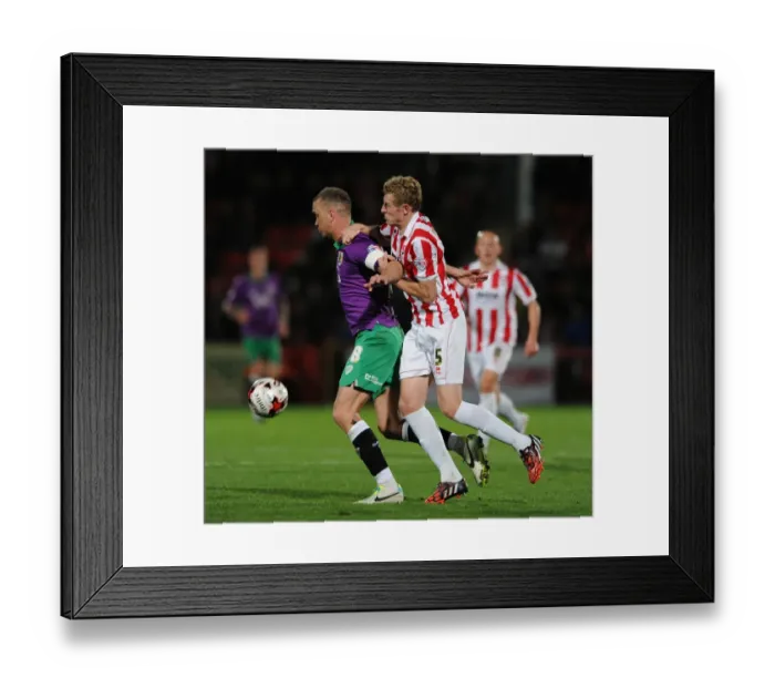 Framed Print : Bristol City's Aaron Wilbraham Secures Ball Against Cheltenham Town's Jack Deaman - Football Rivalry Framed Print : Bristol City's Aaron Wilbraham Secures Ball Against Cheltenham Town's Jack Deaman - Football Rivalry
