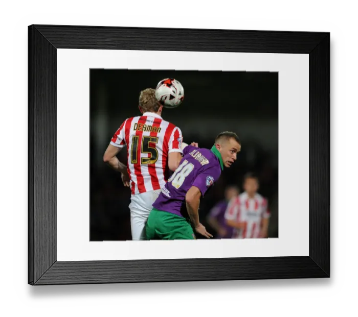 Framed Print : Intense Rivalry: Wilbraham vs Deaman - The Battle for the Ball in Cheltenham Town vs Bristol City Football Match, October 2014