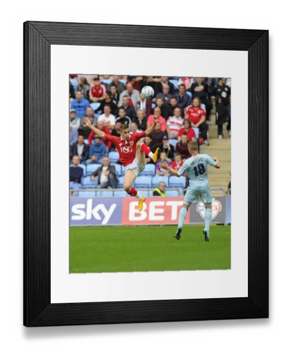 Framed Print : Battling for Supremacy: Joe Bryan vs. Aaron Phillips in Bristol City's Sky Bet League One Clash at Ricoh Arena Framed Print : Battling for Supremacy: Joe Bryan vs. Aaron Phillips in Bristol City's Sky Bet League One Clash at Ricoh Arena