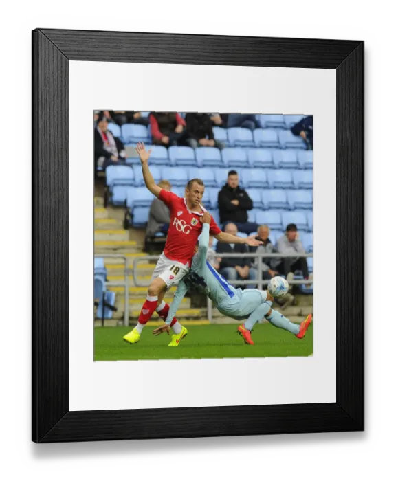 Framed Print : Battling Rivals: Wilbraham vs. Clarke in the Intense Bristol City vs. Coventry City Football Match