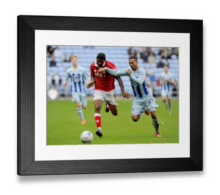 Framed Print : Battling for Control: Mark Little vs. Jordan Clarke in Sky Bet League One Clash
