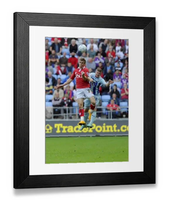 Framed Print : Battling for the Ball: Joe Bryan vs. Aaron Phillips - Sky Bet League One Clash at Ricoh Arena Framed Print : Battling for the Ball: Joe Bryan vs. Aaron Phillips - Sky Bet League One Clash at Ricoh Arena