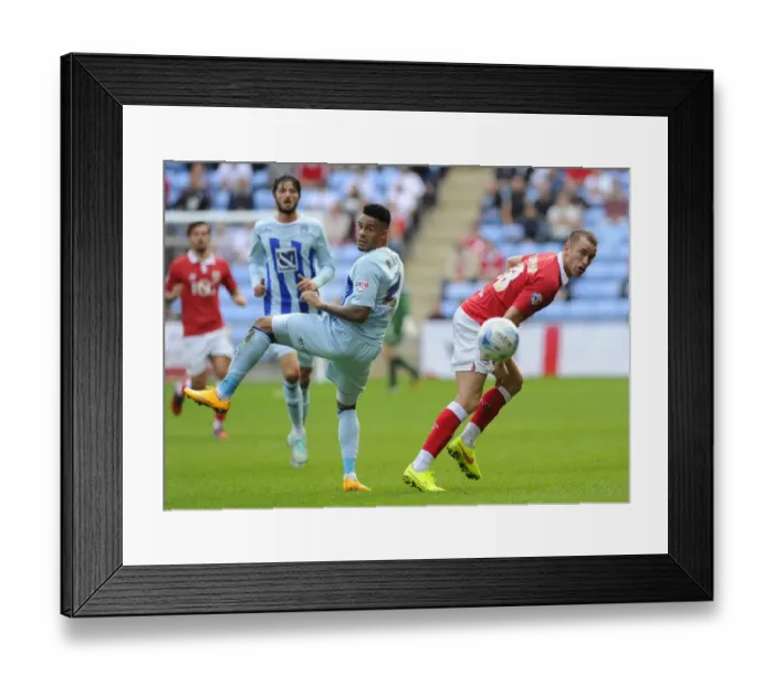 Framed Print : Battling for the High Ball: Wilbraham vs. Willis in Sky Bet League One Clash