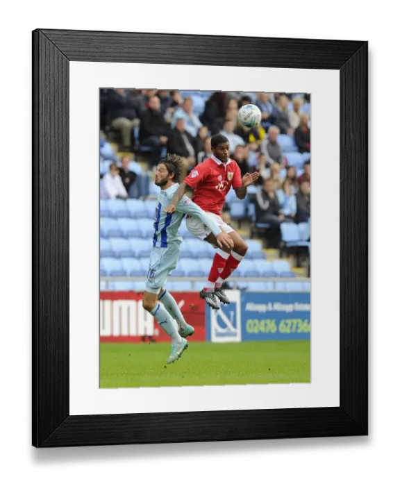 Framed Print : Battling for the High Ball: Mark Little vs. Adam Barton - Sky Bet League One Clash at Ricoh Arena Framed Print : Battling for the High Ball: Mark Little vs. Adam Barton - Sky Bet League One Clash at Ricoh Arena