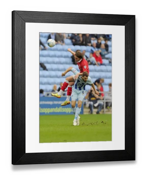 Framed Print : Battling for Supremacy: Freeman vs McQuoid in Intense Sky Bet League One Clash