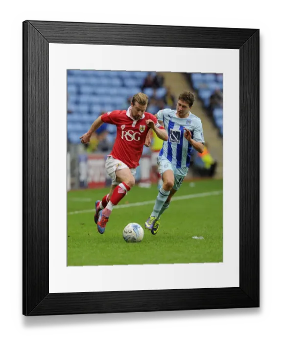 Framed Print : Battling for Supremacy: Wade Elliott vs. Shaun Miller in Bristol City's Sky Bet League One Clash at Ricoh Arena Framed Print : Battling for Supremacy: Wade Elliott vs. Shaun Miller in Bristol City's Sky Bet League One Clash at Ricoh Arena
