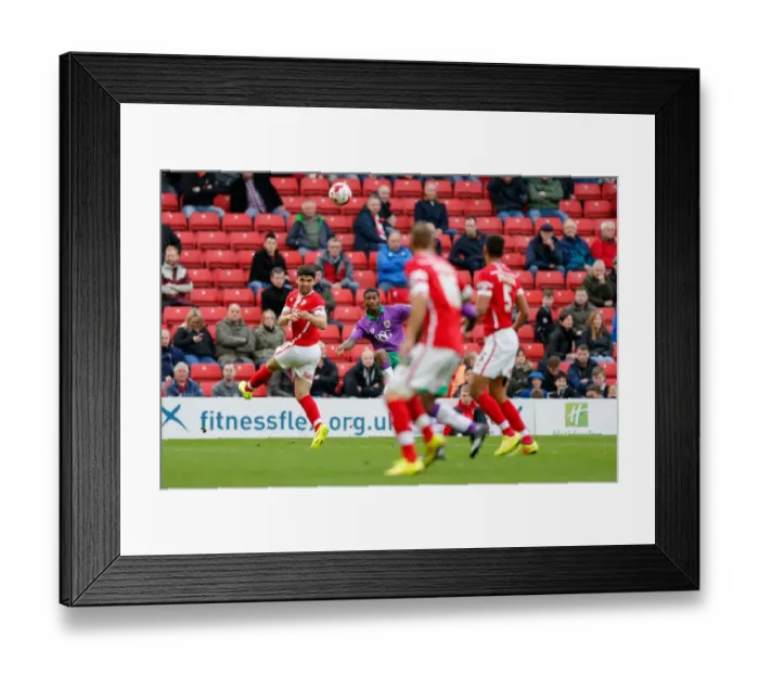 Framed Print : Bristol City's Mark Little Sends a Cross at Barnsley's Oakwell Stadium, 2014