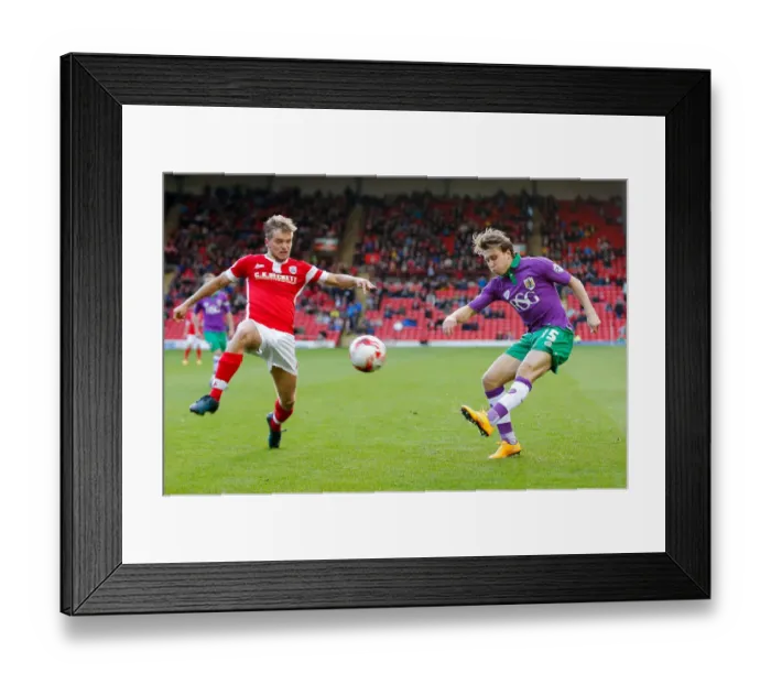 Framed Print : Bristol City's Luke Freeman Sends a Cross Past Barnsley's Luke Berry during the Sky Bet League 1 Match Framed Print : Bristol City's Luke Freeman Sends a Cross Past Barnsley's Luke Berry during the Sky Bet League 1 Match