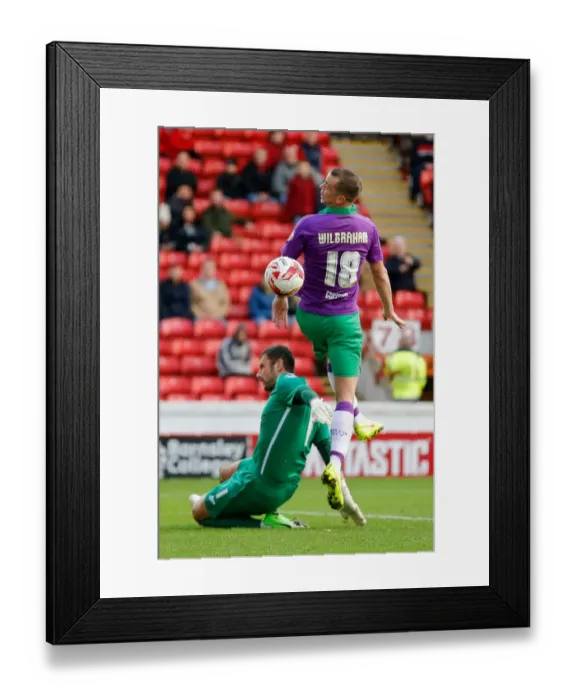 Framed Print : Bristol City's Wilbraham Heads the Ball Against Barnsley's Turnbull - Football Rivalry at Oakwell Stadium Framed Print : Bristol City's Wilbraham Heads the Ball Against Barnsley's Turnbull - Football Rivalry at Oakwell Stadium