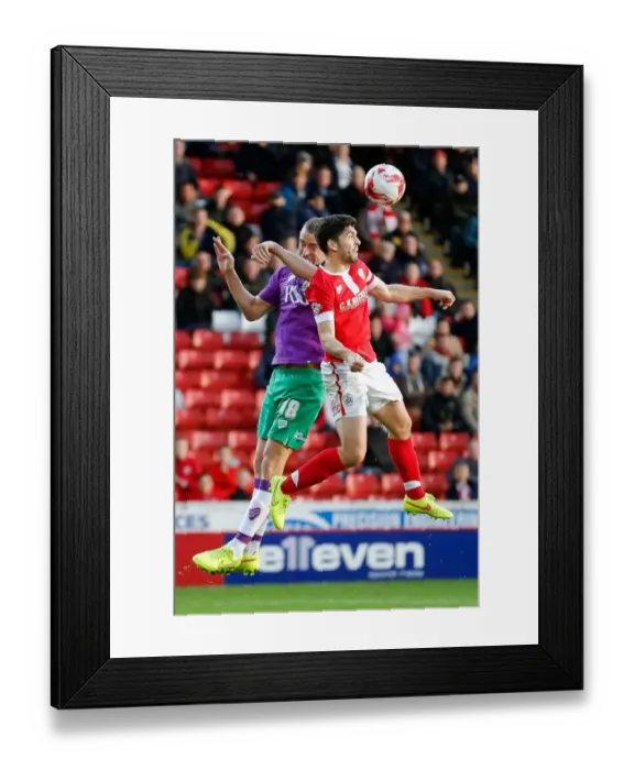 Framed Print : Bristol City's Wilbraham and Barnsley's Dudgeon Clash in Aerial Showdown at Oakwell Stadium Framed Print : Bristol City's Wilbraham and Barnsley's Dudgeon Clash in Aerial Showdown at Oakwell Stadium