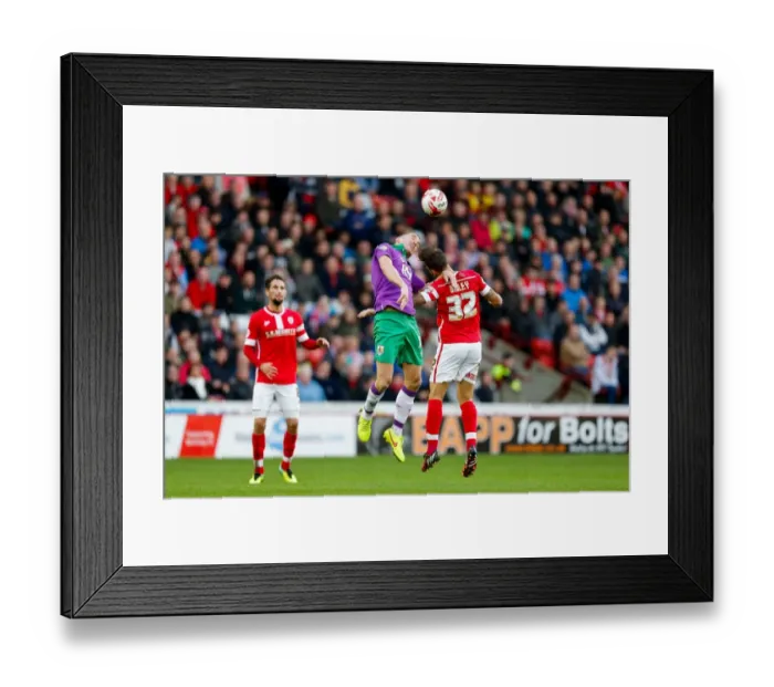 Framed Print : Bristol City vs Barnsley: Intense Aerial Battle Between Aaron Wilbraham and James Bailey Framed Print : Bristol City vs Barnsley: Intense Aerial Battle Between Aaron Wilbraham and James Bailey