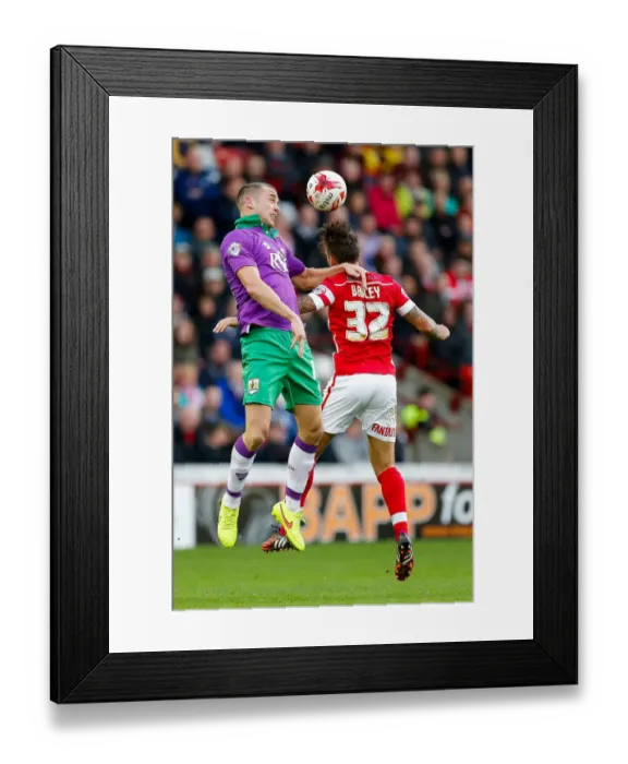 Framed Print : Intense Aerial Clash: Wilbraham vs Bailey at Barnsley's Oakwell Stadium Framed Print : Intense Aerial Clash: Wilbraham vs Bailey at Barnsley's Oakwell Stadium