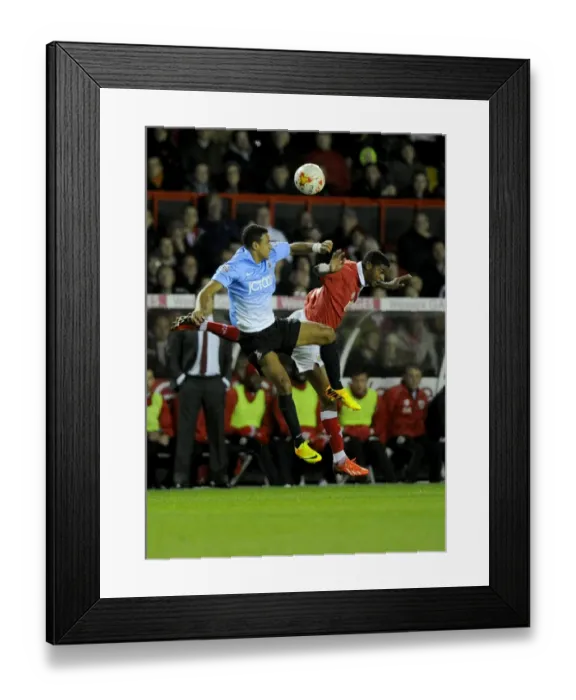 Framed Print : Battling for the High Ball: Mark Little vs. James Meredith - Sky Bet League One Clash Framed Print : Battling for the High Ball: Mark Little vs. James Meredith - Sky Bet League One Clash