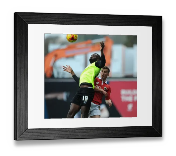 Framed Print : Intense Aerial Battle: Bryan vs. Ibehre - Sky Bet League One Clash at Ashton Gate Framed Print : Intense Aerial Battle: Bryan vs. Ibehre - Sky Bet League One Clash at Ashton Gate