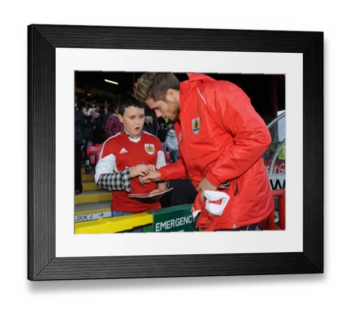 Framed Print : Bristol City's Wes Burns Signs Autograph for Fan at Ashton Gate Framed Print : Bristol City's Wes Burns Signs Autograph for Fan at Ashton Gate