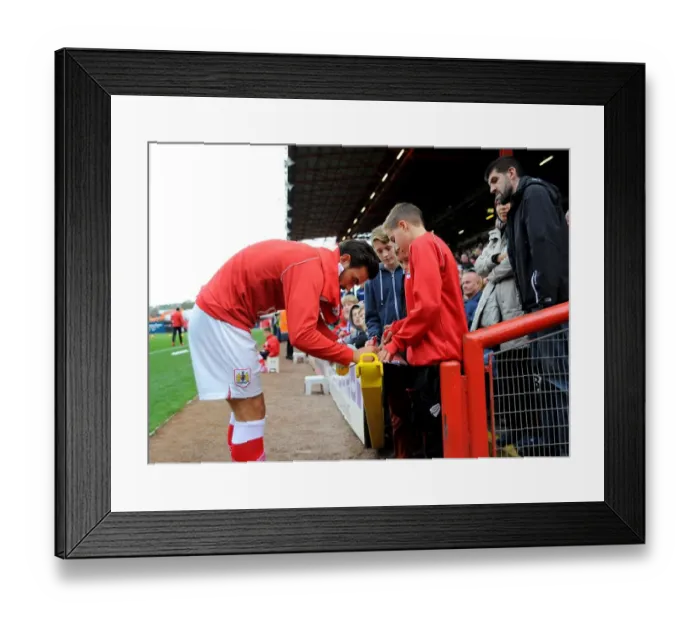Framed Print : Marlon Pack of Bristol City Signing Autographs at Ashton Gate during Bristol City vs Oldham Football Match, November 2014