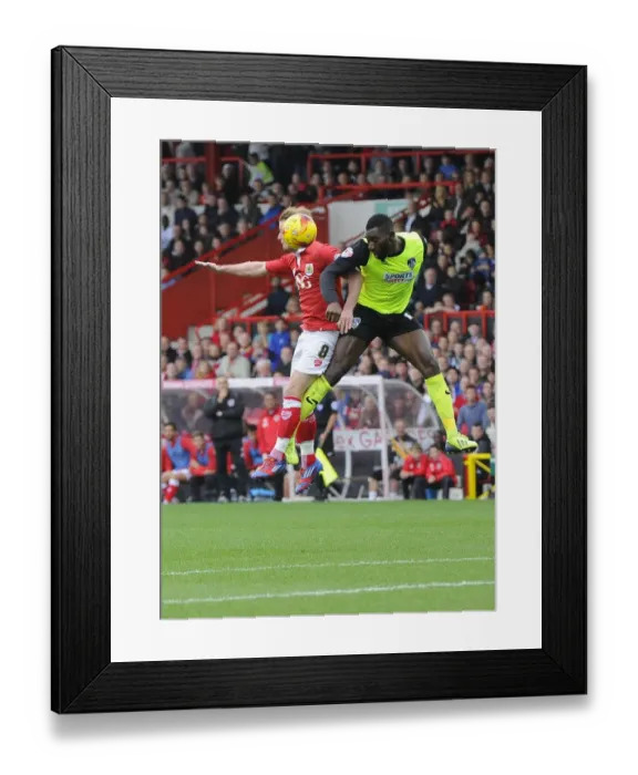 Framed Print : Aerial Battle: Wade Elliott vs. Genserix Kusunga - Bristol City vs. Oldham Athletic, Sky Bet League One, Ashton Gate Framed Print : Aerial Battle: Wade Elliott vs. Genserix Kusunga - Bristol City vs. Oldham Athletic, Sky Bet League One, Ashton Gate