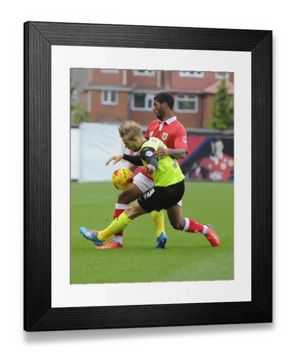 Framed Print : Battling for Supremacy: Mark Little vs. Joseph Mills in Bristol City's Clash with Oldham Athletic Framed Print : Battling for Supremacy: Mark Little vs. Joseph Mills in Bristol City's Clash with Oldham Athletic