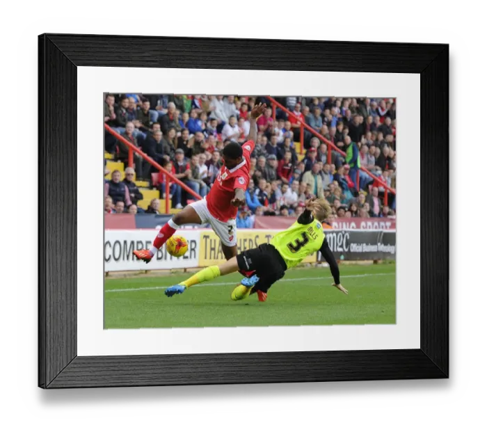 Framed Print : Intense Rivalry: A Football Battle - Mark Little vs Joseph Mills, Bristol City vs Oldham Athletic