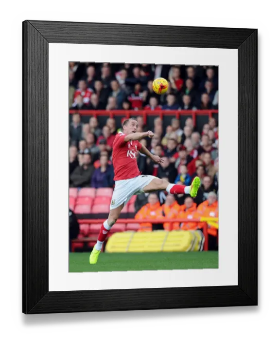 Framed Print : Aaron Wilbraham Reaches for the Ball in Intense Bristol City vs Oldham Athletic Football Match