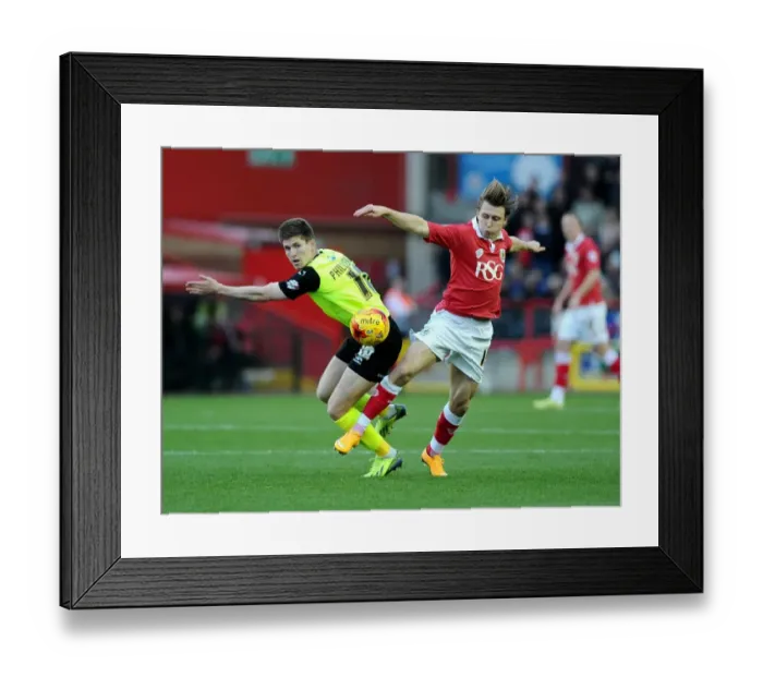 Framed Print : Battling for Possession: Luke Freeman vs. Daniel Philliskirk in Bristol City's Clash with Oldham Athletic