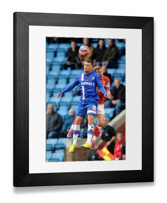 Framed Print : Bristol City's Wade Elliott and Cody McDonald Clash for Header in FA Cup Match against Gillingham