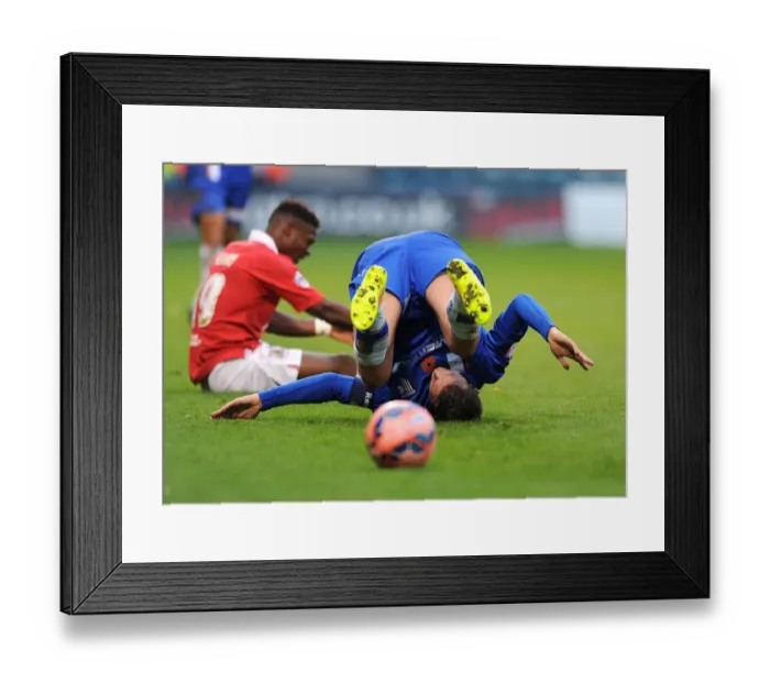 Framed Print : Bristol City's Clash at Priestfield: Doug Loft's Unfortunate Tumble against Gillingham - FA Cup Round One Framed Print : Bristol City's Clash at Priestfield: Doug Loft's Unfortunate Tumble against Gillingham - FA Cup Round One