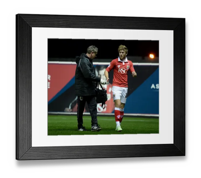 Framed Print : Bristol City's Wes Burns Injured Limps Off Pitch During Bristol City v AFC Wimbledon Match