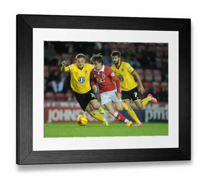 Framed Print : Bristol City's Luke Freeman Charges Forward in Johnstone's Paint Trophy Match Framed Print : Bristol City's Luke Freeman Charges Forward in Johnstone's Paint Trophy Match
