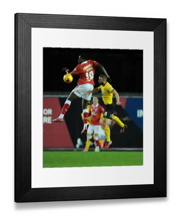 Framed Print : Bristol City's Jay Emmanuel-Thomas Battles for High Ball Against AFC Wimbledon's Sammy Moore during Johnstone's Paint Trophy Match