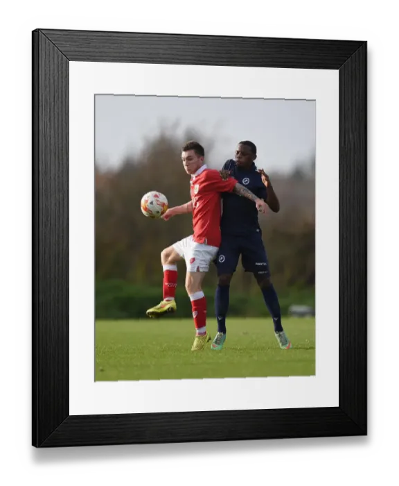 Framed Print : Bristol City's Jamie Horgan Fends Off Millwall's Josh Siafa in U21 PDL2 Clash Framed Print : Bristol City's Jamie Horgan Fends Off Millwall's Josh Siafa in U21 PDL2 Clash