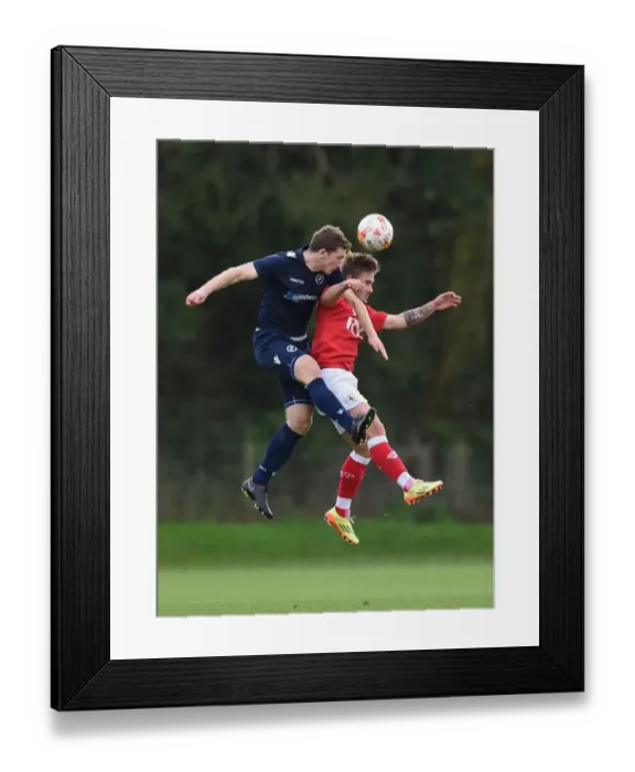 Framed Print : Bristol City vs Millwall: Intense Aerial Battle between Ben Withey and Keaton Wood