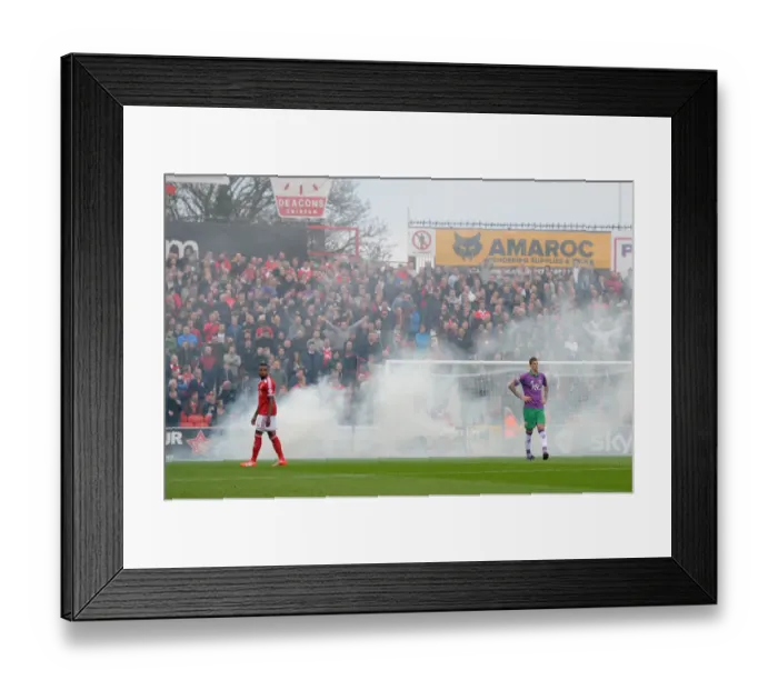 Framed Print : Bristol City Fans Unleash Smoke at Swindon Town's County Ground During Sky Bet League One Match Framed Print : Bristol City Fans Unleash Smoke at Swindon Town's County Ground During Sky Bet League One Match
