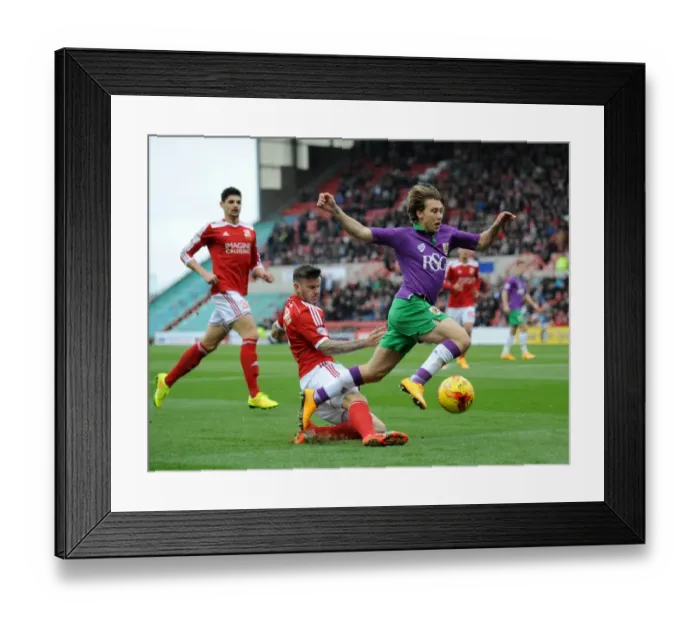Framed Print : Bristol City's Luke Freeman Tackled by Swindon Town's Ben Gladwin during Swindon Town vs. Bristol City, Sky Bet League One Match Framed Print : Bristol City's Luke Freeman Tackled by Swindon Town's Ben Gladwin during Swindon Town vs. Bristol City, Sky Bet League One Match