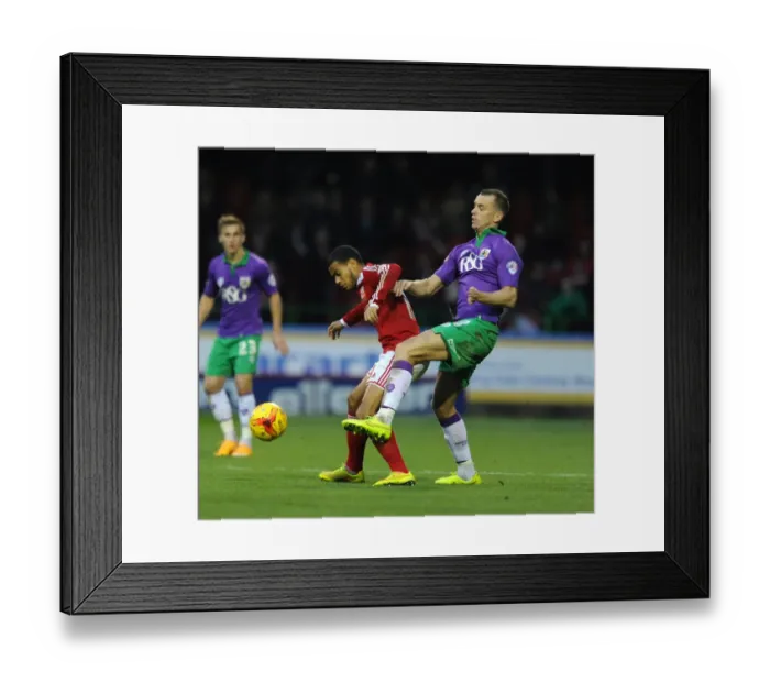 Framed Print : Aaron Wilbraham's Intense Challenge on Louis Thompson during Swindon Town vs. Bristol City Framed Print : Aaron Wilbraham's Intense Challenge on Louis Thompson during Swindon Town vs. Bristol City
