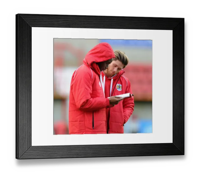 Framed Print : Bristol City Duo Wes Burns and Jordan Wynter Reviewing Match Program Before Swindon Town Clash, 15th November 2014 Framed Print : Bristol City Duo Wes Burns and Jordan Wynter Reviewing Match Program Before Swindon Town Clash, 15th November 2014