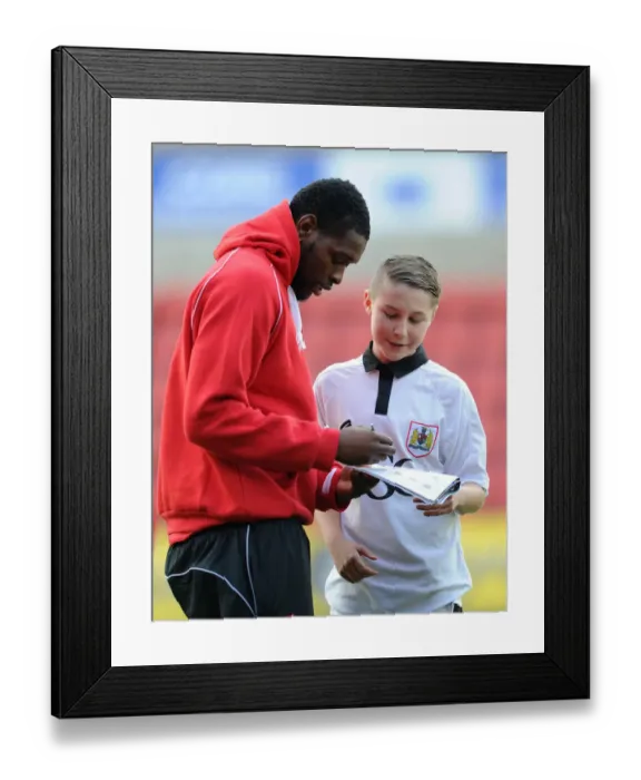 Framed Print : Bristol City's Jay Emmanuel-Thomas and Mascot Celebrate at Swindon Town's County Ground