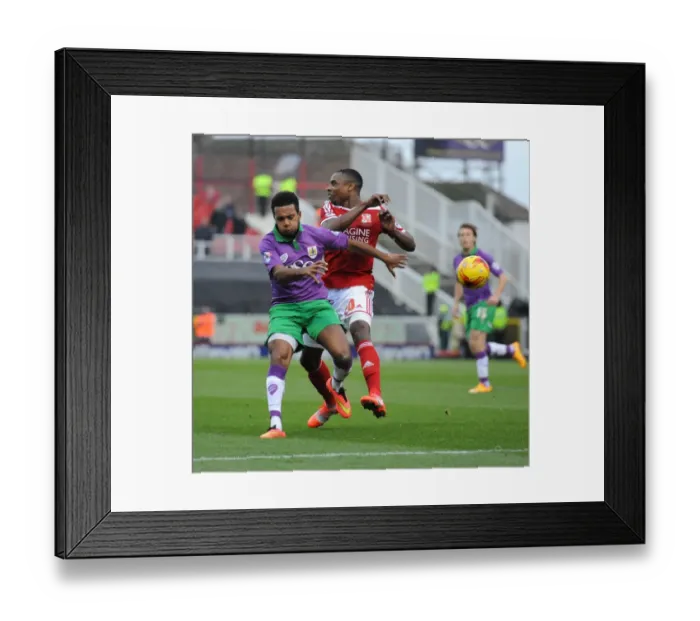 Framed Print : Bristol City's Korey Smith Closes In on Swindon Town's Jonathan Obika in Sky Bet League One Clash
