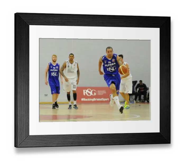 Framed Print : Bristol Flyers Doug McLaughlin-Williams Charges Forward Against Plymouth Raiders in Basketball Action