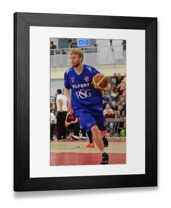 Framed Print : Intense Rivalry: Flyers vs. Raiders - Mathias Seilund's Focus during Basketball Match Framed Print : Intense Rivalry: Flyers vs. Raiders - Mathias Seilund's Focus during Basketball Match