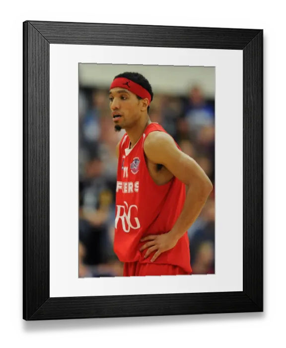 Framed Print : Intense Basketball Showdown: Flyers vs. Wildcats - Bristol Flyers in Action