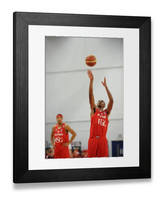 Framed Print : Intense Rivalry on the Basketball Court: Flyers vs. Wildcats