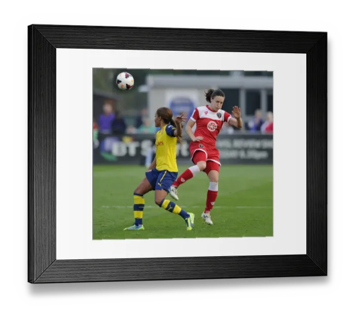 Framed Print : Bristol Academy vs Arsenal Ladies: Intense Moment as Corinne Yorston Faces Off Against Alex Scott